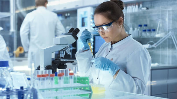 Scientists conducting research in a biopharma lab